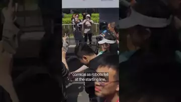 China’s first robot marathon runners trip, emit smoke, fall apart#shorts #robots #china #ai
