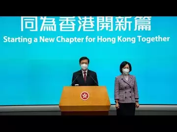 Hong Kong's New Leader Stresses Cautious Opening on Virus